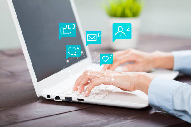 Female hands using laptop with icon social media and social network"r